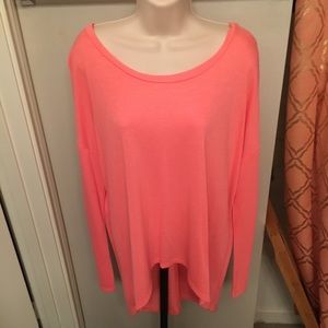 Pink long sleeved high low top